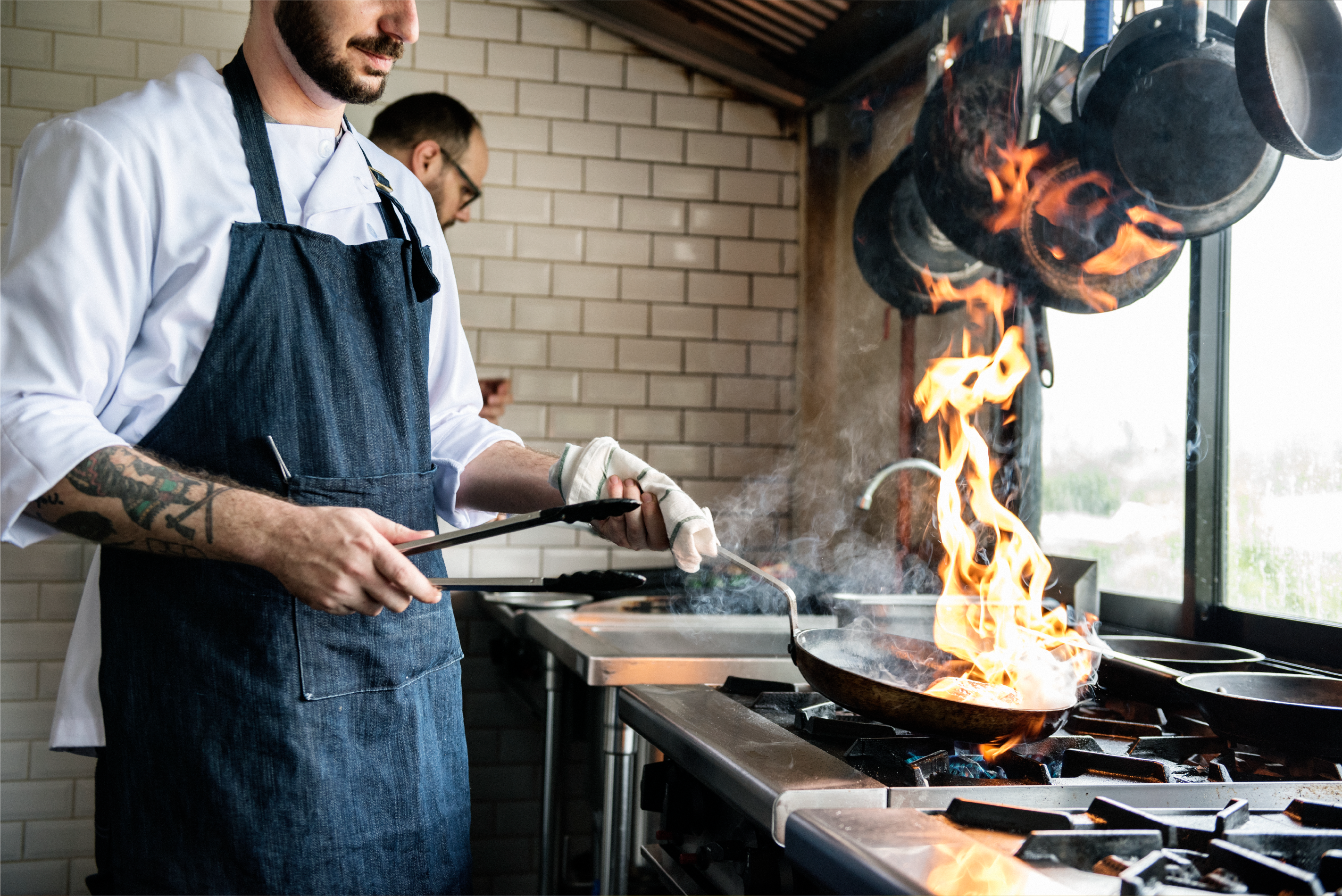 Rally for your Bar and Restaurant PayFast Split Payments - a chef cooking with fire